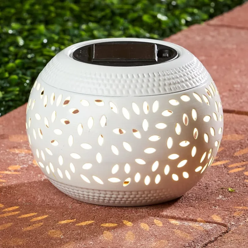 Solar Cutout Shadow Cast Round Table Lanterns