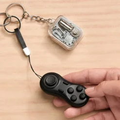 World's Smallest Toys - Whimsical Music Box or Handy Game Pad Remote